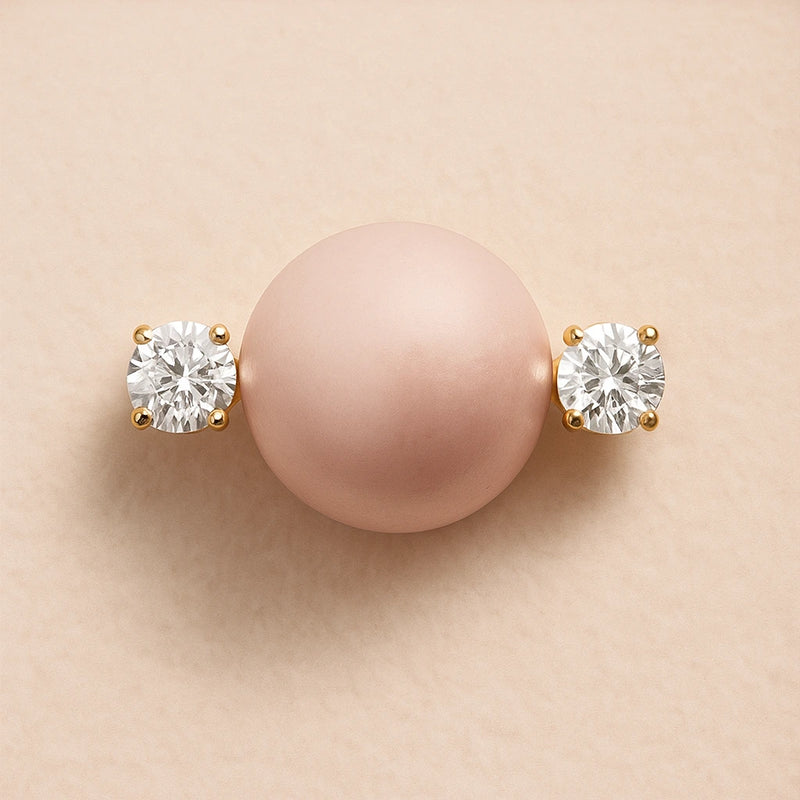 Close-up detail of 14k yellow gold diamond nipple barbell showing prong-set round brilliant diamonds flanking the barbell shaft