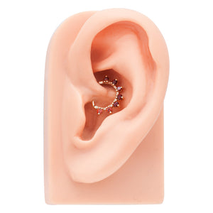 Rose gold diamond petal clicker ring shown in daith piercing on ear model for fit reference