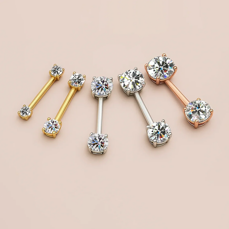 Diamond prong nipple barbells in all three metal options: 14k yellow gold, white gold, and rose gold side by side