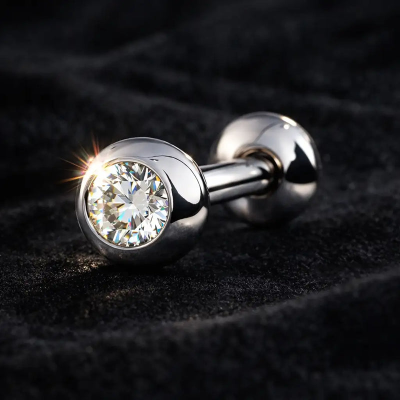 Close-up of 14k white gold diamond tongue ring on dark velvet, diamond sparkle detail