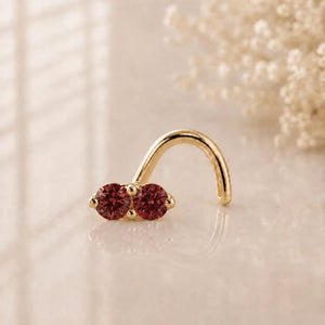 Two rubies nose ring in yellow gold. Lifestyle Photograph.