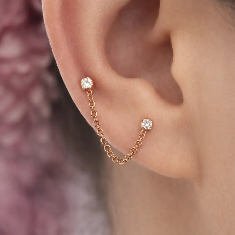 14k rose gold duo gem chain connector worn on ear, linking lobe and lower cartilage piercings