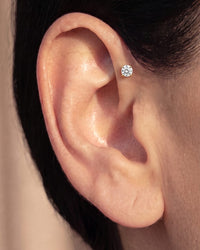 Diamond flat back stud worn in a forward helix piercing at the front of the ear