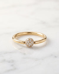 Captive bead rings - 14k yellow gold fixed bead ring with diamond pave ball on white marble