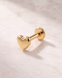 Charm flat back studs - 4mm artisan polished 14k yellow gold heart flat back stud on white marble