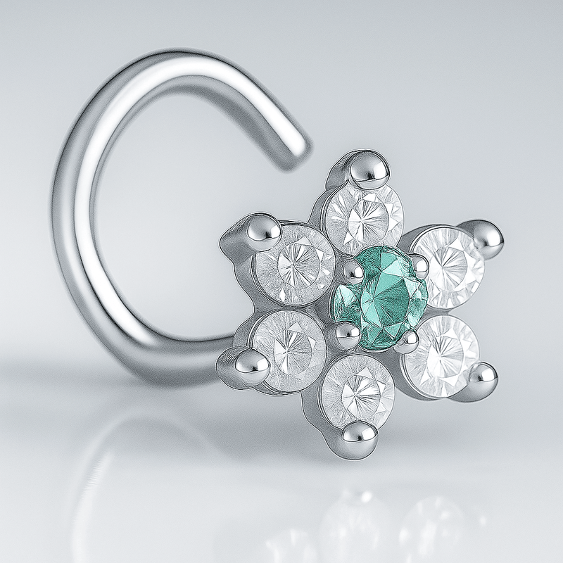 14K white gold CZ flower nose ring twist with aqua center CZ, angled close-up on gray background