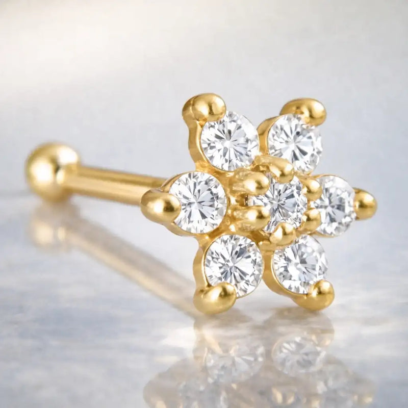14K yellow gold flower nose bone with all-clear CZ stones, angled view showing ball end and bone post