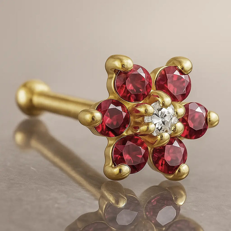 14K yellow gold flower nose bone with red CZ petals and clear CZ center, angled product view