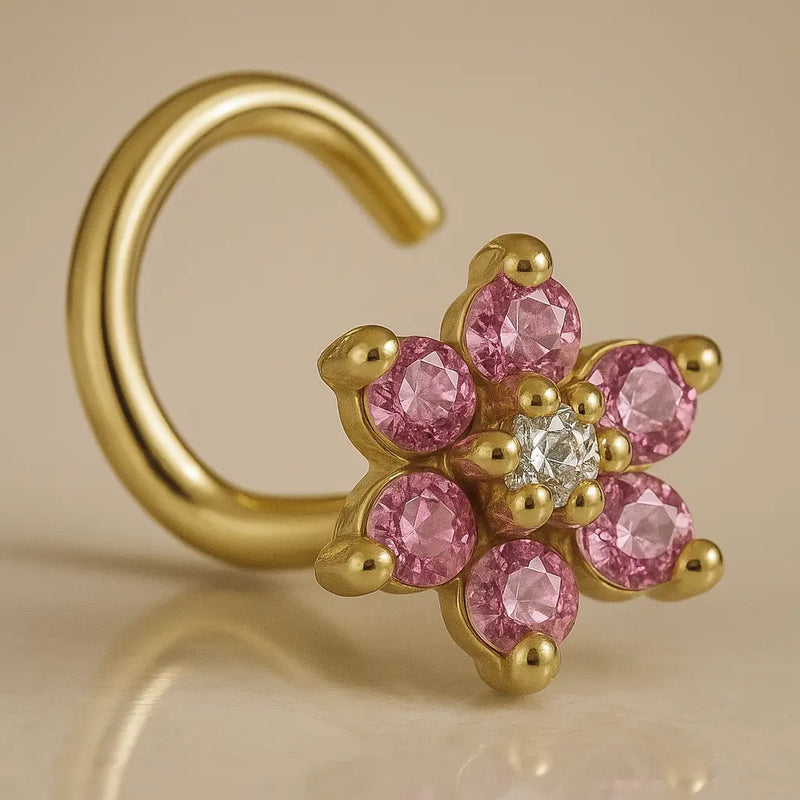 14K yellow gold flower nose twist with pink CZ petals and clear center CZ, angled view