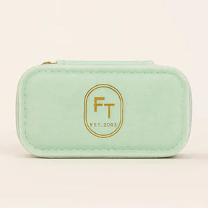 FreshTrends mint green travel jewelry box, closed front view with gold FT Est. 2003 logo