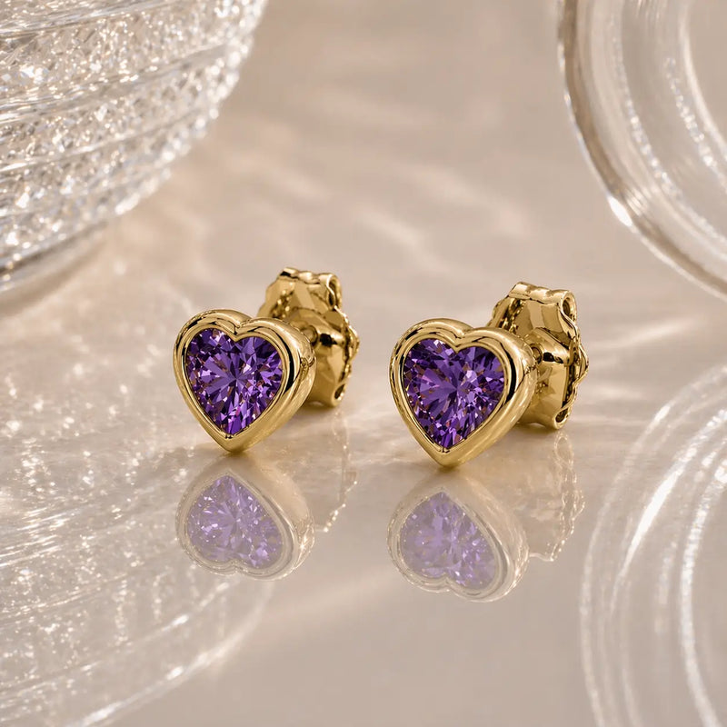 14k yellow gold amethyst heart stud earrings pair, bezel-set deep purple stones with reflections