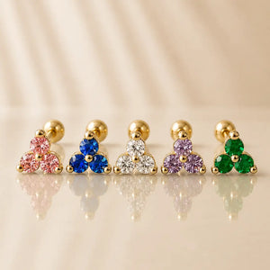 14k yellow gold triple birthstone cartilage earrings in five gemstone colors lined up for comparison