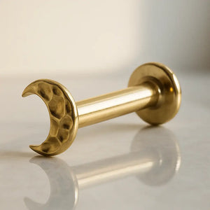 14K yellow gold hammered crescent moon flat back labret, angled view showing post and flat disc back