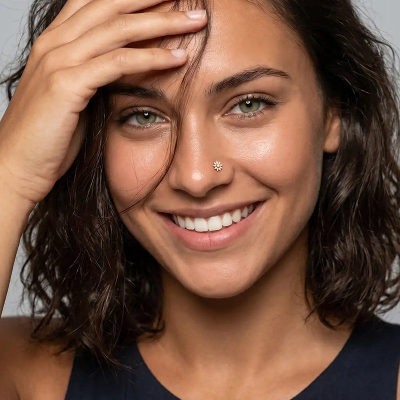 Model wearing the Jasmine Nose Ring in solid 14k gold - for nostril piercings