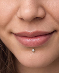 Labret piercing - 14k yellow gold diamond flat back stud centred below the lower lip