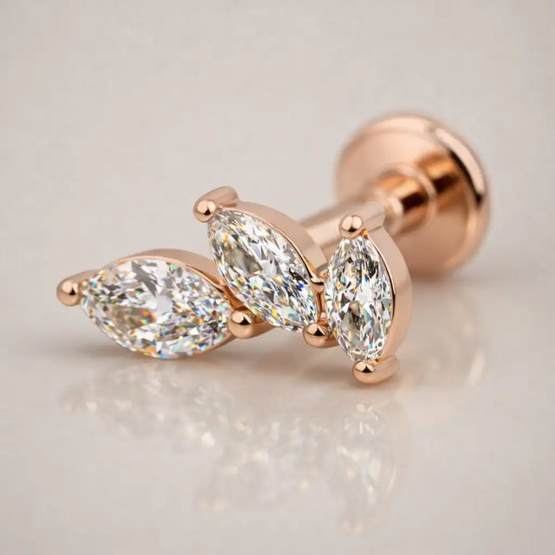 14k rose gold marquise diamond cascade flat back stud, angled view with warm-toned prong setting detail
