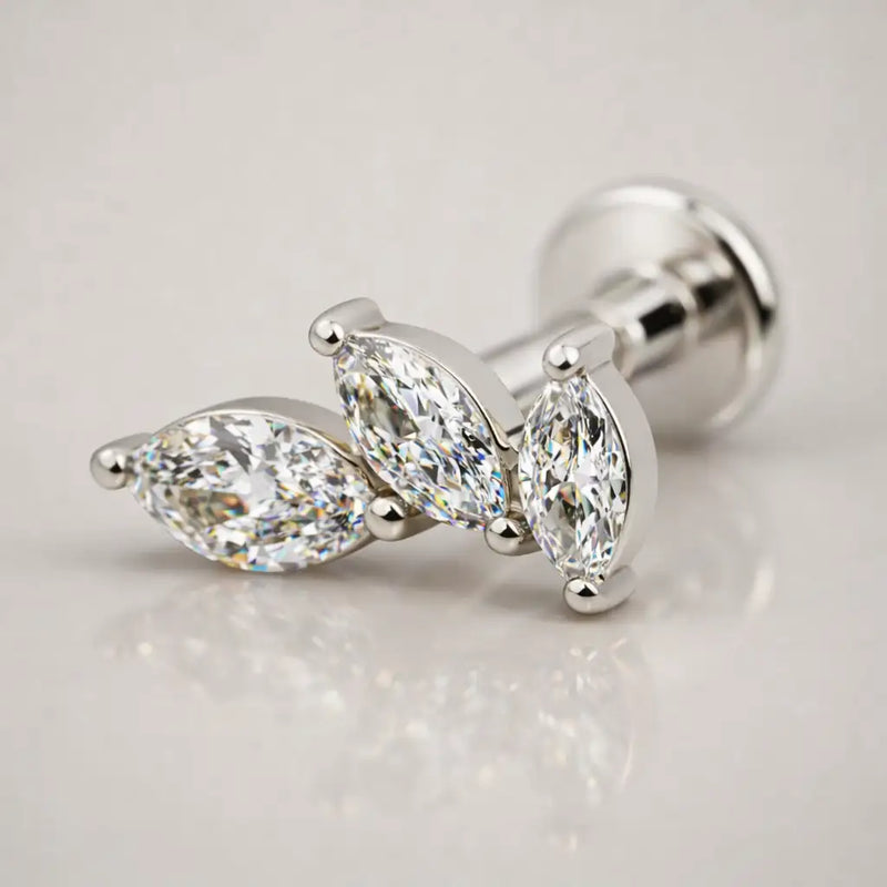 14k white gold marquise diamond cascade labret stud, angled view highlighting three-stone leaf silhouette