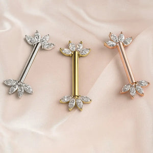 Marquise fan nipple barbells in 14K white, yellow, and rose gold with clear stones on blush satin