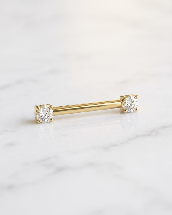 Nipple barbells - 14k yellow gold straight barbell with prong-set diamonds on white marble