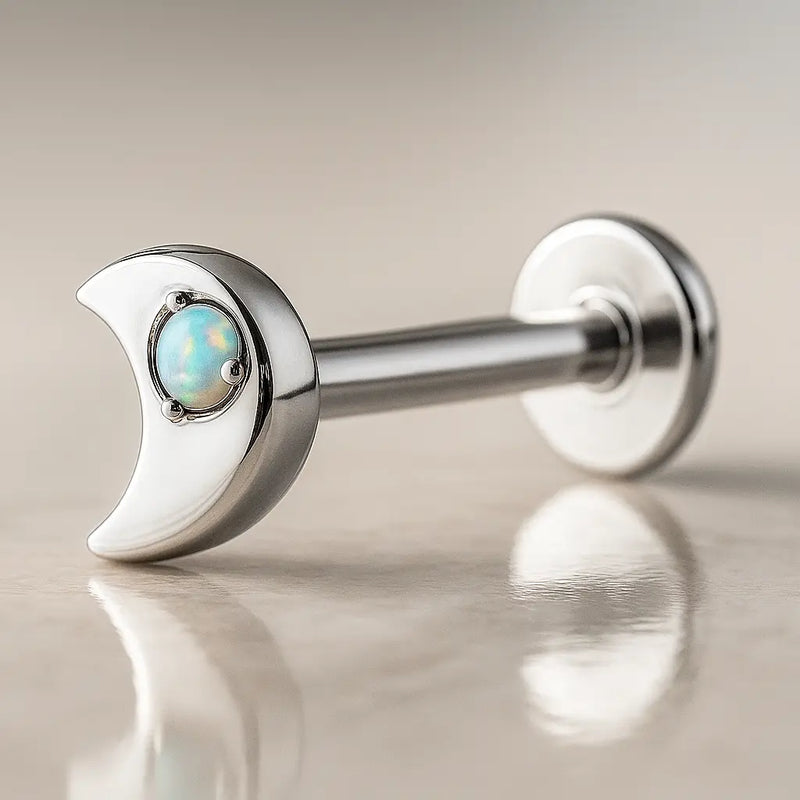 14k white gold crescent moon opal flat back labret, angled view showing post and flat disc backing
