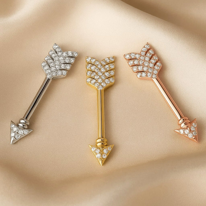 Diamond pavé arrow nipple barbells in all three metal options: 14k white, yellow, and rose gold