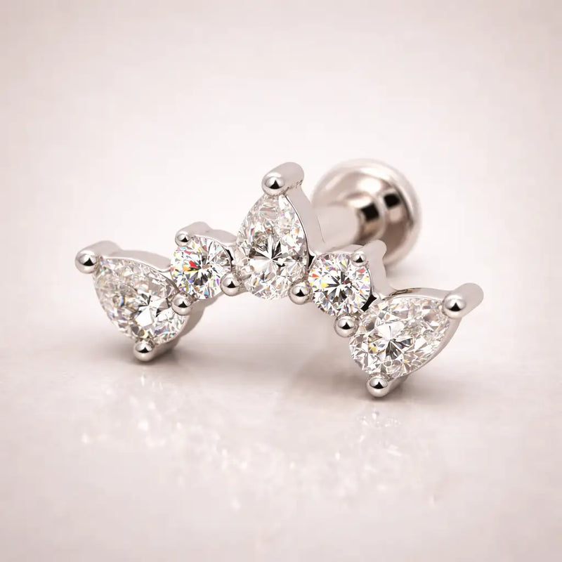 14k white gold diamond pear climber flat back stud, angled view highlighting pear and round diamond setting