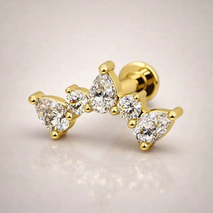 14k yellow gold diamond pear climber flat back stud, angled view showing curved climbing silhouette