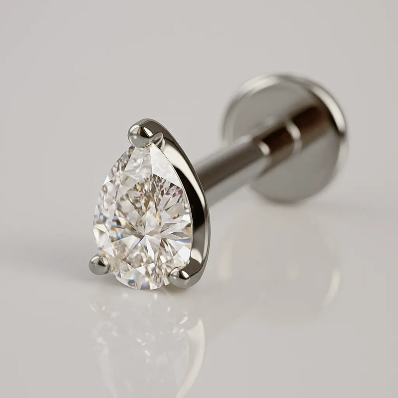 14k white gold 3mm pear-cut diamond flat back labret stud, angled view showing 3-prong setting and disc