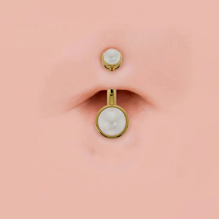 Bezel-set Akoya pearl 14k gold belly ring shown in navel piercing for fit reference