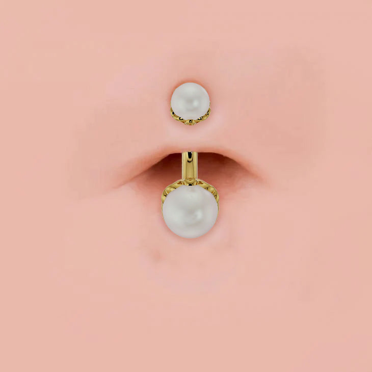 14k yellow gold dual Akoya pearl belly ring shown in navel piercing for fit and scale reference