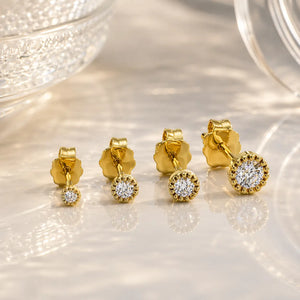 14K yellow gold diamond perlage stud earrings in three sizes showing bead bezel setting comparison