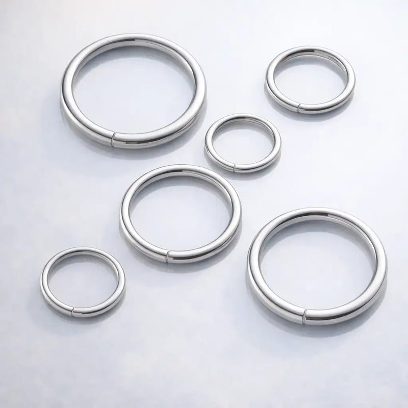 Six platinum seam ring hoops in varying diameters arranged together to show size range