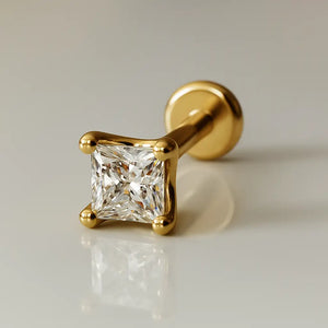 14k yellow gold 2.5mm princess-cut diamond flat back labret stud, angled studio shot on neutral background
