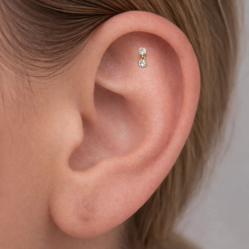 14k yellow gold prong diamond dangle cartilage flat back stud shown in helix piercing on model