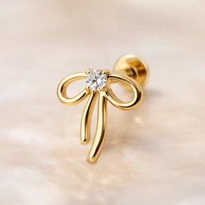 14k yellow gold ribbon bow diamond flat back stud, angled view showing flat disc backing