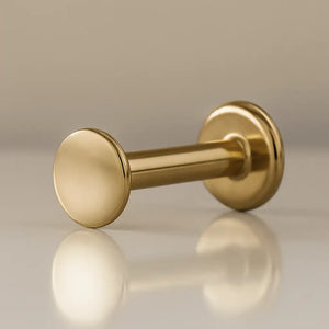 14K yellow gold 3mm polished disc flat back labret, angled view showing disc end and flat back