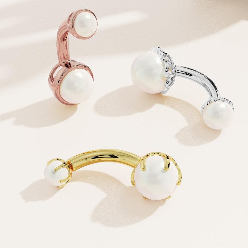 Akoya pearl navel rings in rose gold, white gold, and yellow gold shown together for metal color comparison