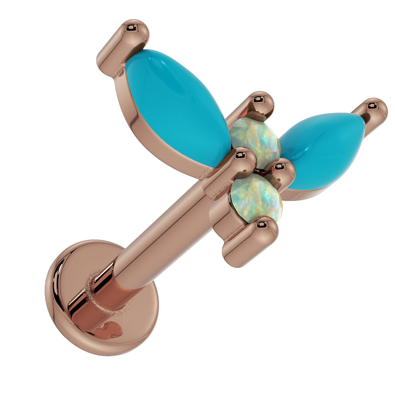 Top-down angled view of 14K rose gold firefly flat back labret showing barbell post and opal turquoise top