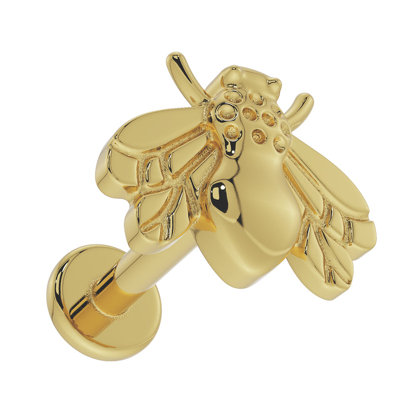 14K yellow gold bee flat back labret, overhead angled view revealing textured body and post assembly