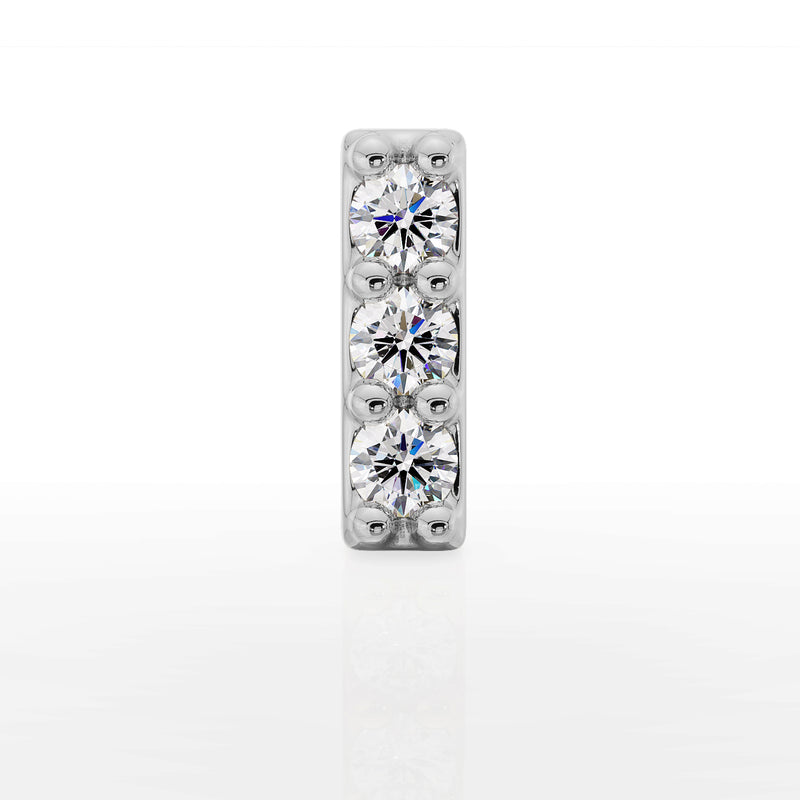 Close-up front view of 14k white gold diamond bar top with three brilliant round diamonds in shared prong setting