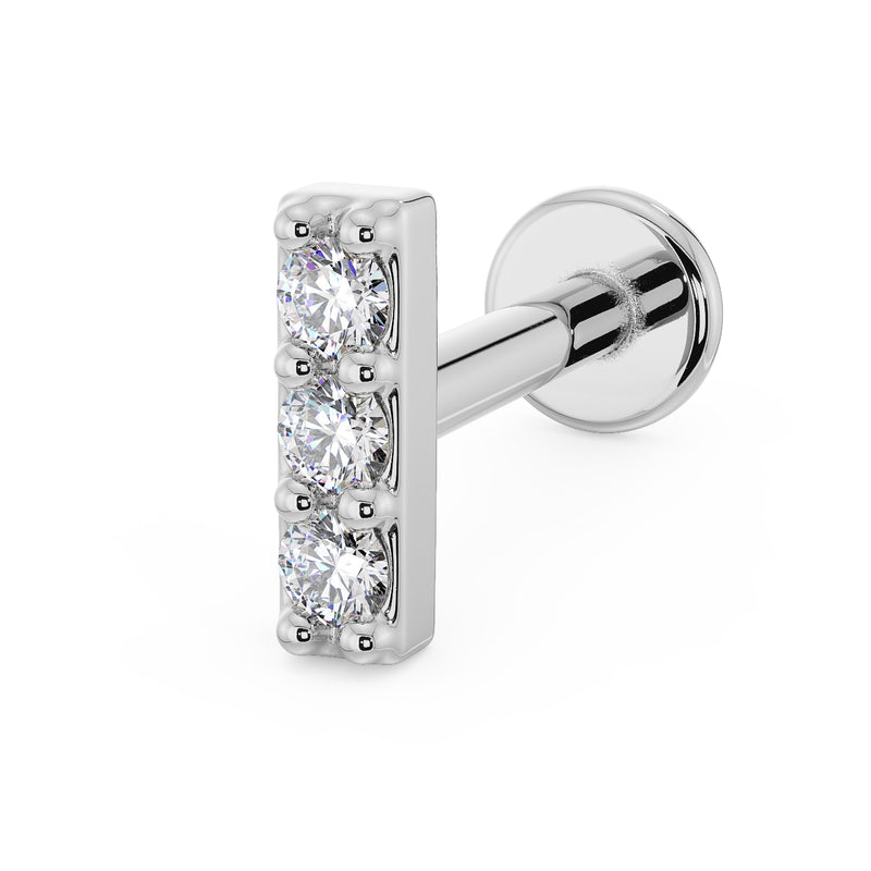 14k white gold three-diamond bar flat back labret earring, angled view with flat disc post visible