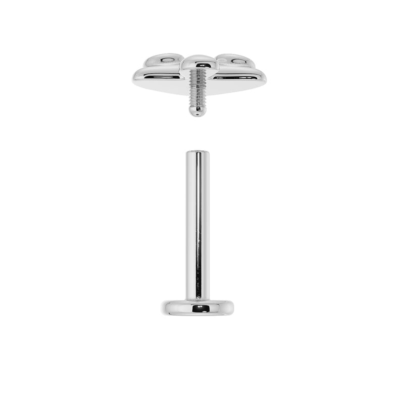 Disassembled flat back labret post and mushroom top showing threaded screw connection detail