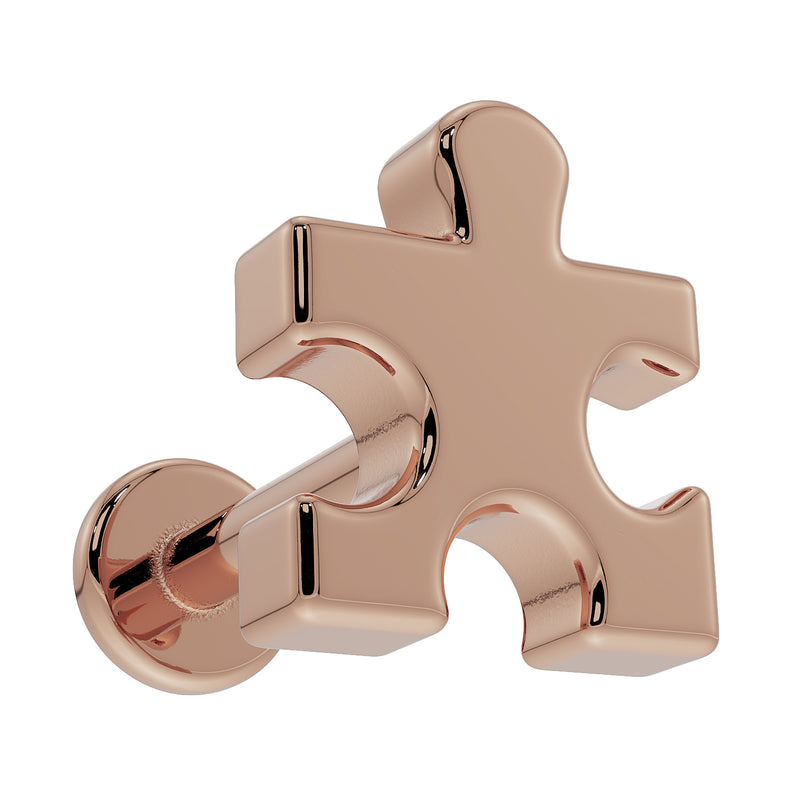 14K rose gold puzzle piece flat back earring viewed from below at an angle, highlighting 3D depth of charm