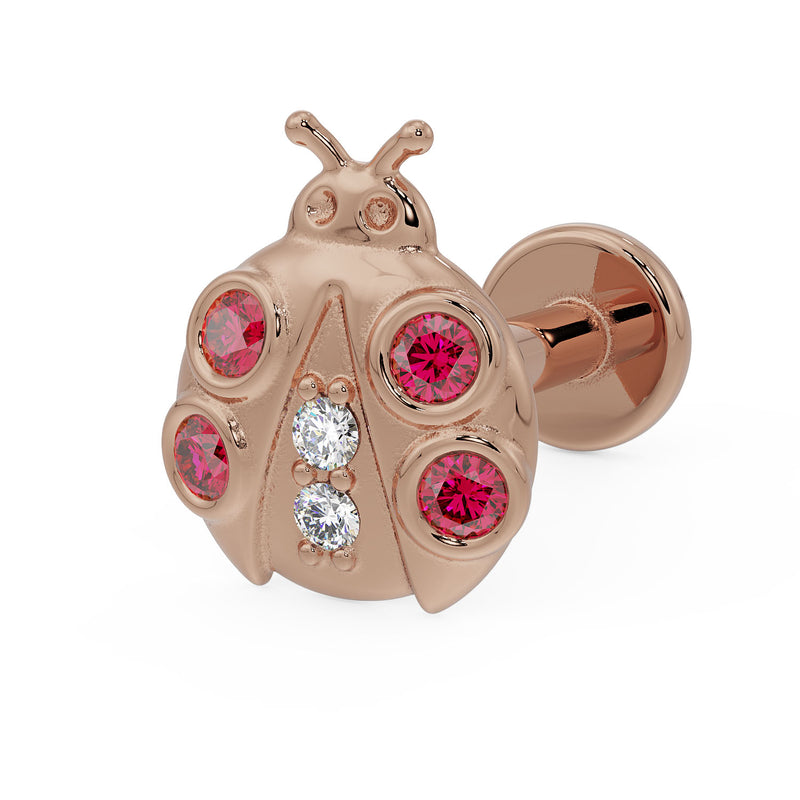 14K rose gold ladybug flat back earring with garnet and diamond accents, angled view showing disc back