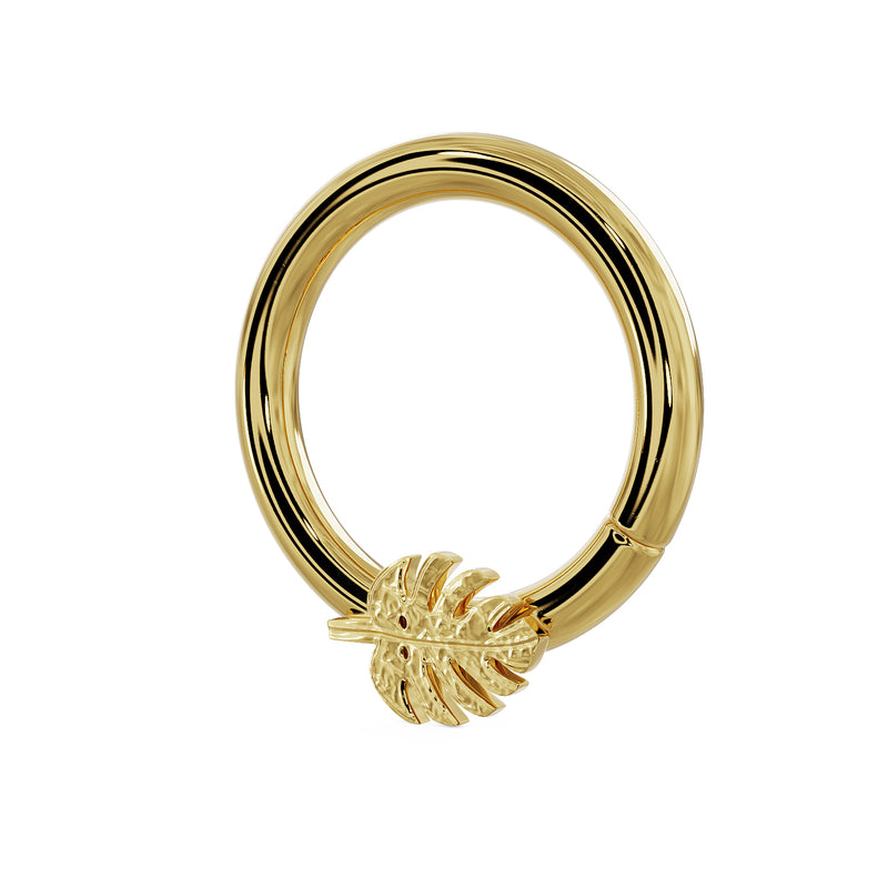 14K yellow gold monstera leaf seam ring, angled side view highlighting leaf charm and hoop profile