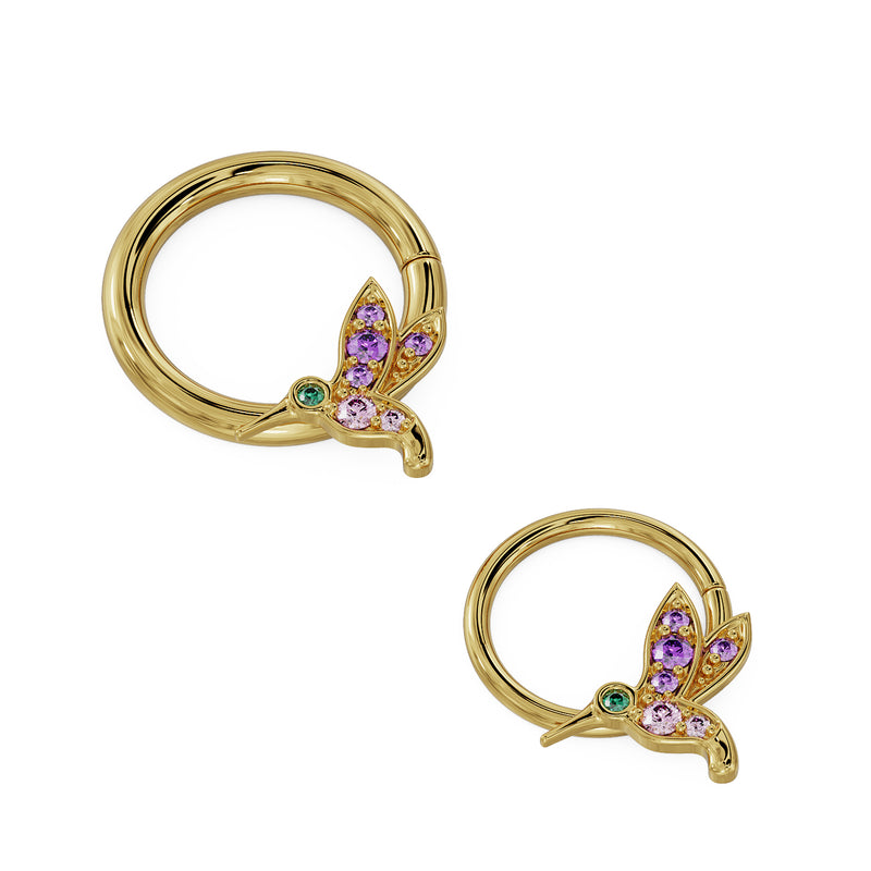 Two 14K yellow gold hummingbird seam rings side by side showing large and small diameter size comparison