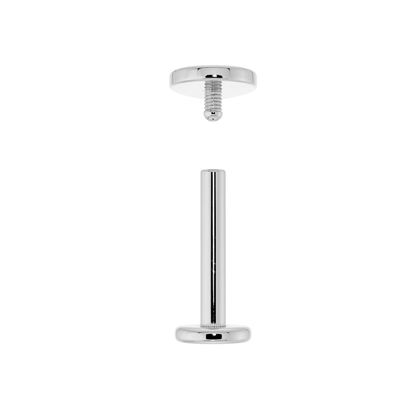Disassembled 14k white gold flat back labret showing threaded top and barbell post separated