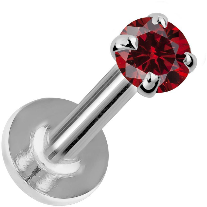 3mm ruby flat back labret in 14K white gold with four-prong setting, angled view on white background