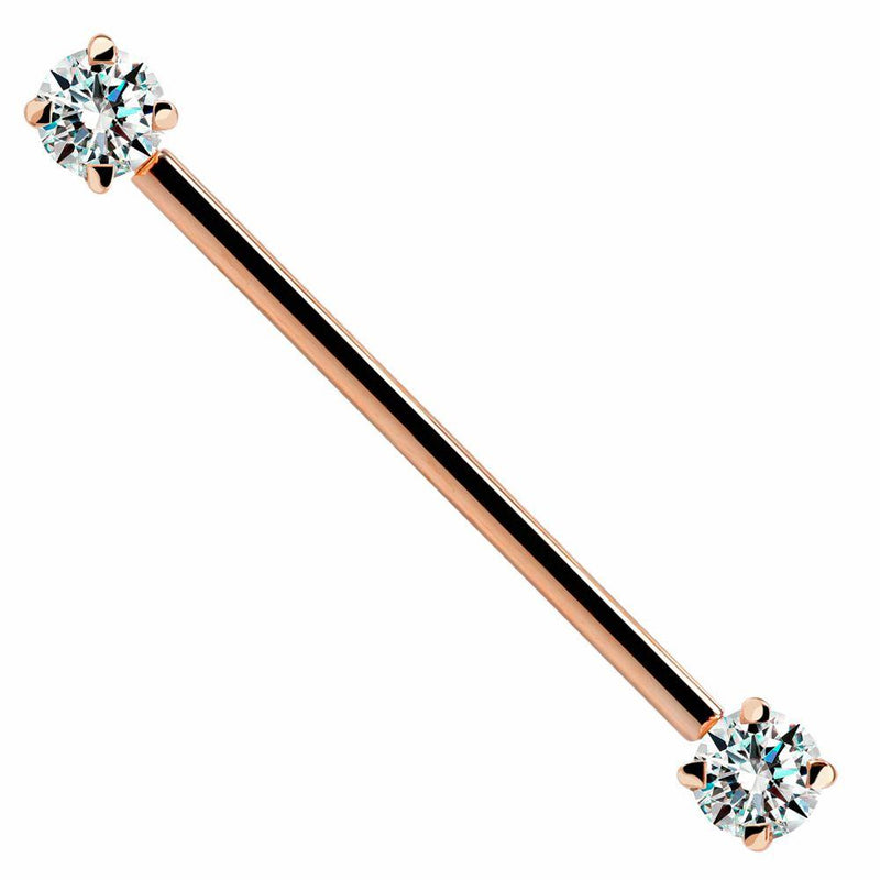 14k rose gold industrial barbell with dual clear CZ prong-set ends, front view on white background