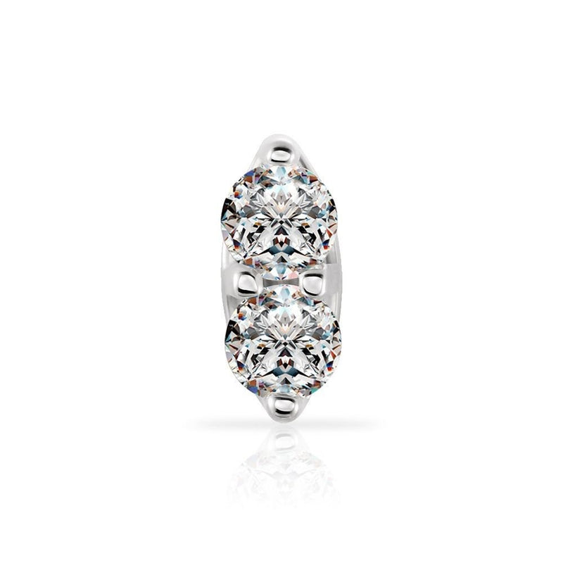 Macro close-up of two prong-set round diamonds in 14K white gold nose stud setting, front view